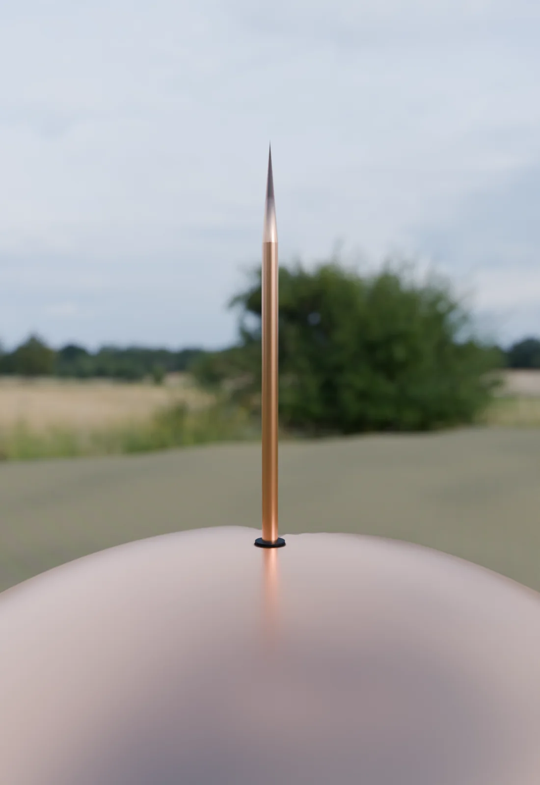 The copper rod rising from the top of the outer sphere