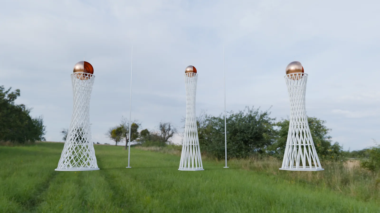 Three Space-Time Antenna towers standing in a field
